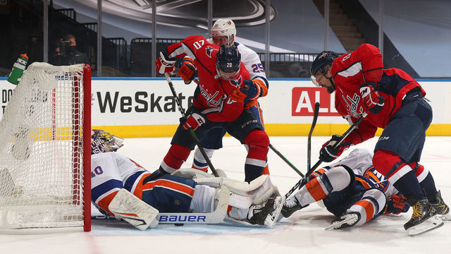 TORONTO, ONTARIO - AUGUST 20: Alex Ovechkin #8 and Lars Eller #20 of the Washington Capitals look to put the puck in the net past a sprawled out goaltender Semyon Varlamov #40 of the New York Islanders in the second period of Game Five of the Eastern Conference First Round of the 2020 NHL Stanley Cup Playoff between the New York Islanders and the Washington Capitals at Scotiabank Arena on August 20, 2020 in Toronto, Ontario.