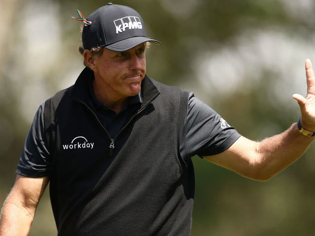 SAN FRANCISCO, CALIFORNIA - AUGUST 08: Phil Mickelson of the United States waves to fans outside a fence near the 12th hole during the third round of the 2020 PGA Championship at TPC Harding Park on August 08, 2020 in San Francisco, California.