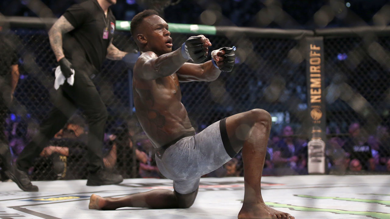 MELBOURNE, AUSTRALIA - OCTOBER 06: Israel Adesanya celebrates his victory over Robert Whittaker between in their Middleweight title bout during UFC 243 at Marvel Stadium on October 06, 2019 in Melbourne, Australia.