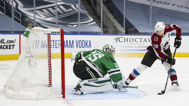EDMONTON, ALBERTA - AUGUST 05: Nathan MacKinnon #29 of the Colorado Avalanche goes to the net against Anton Khudobin #35 of the Dallas Stars during the first period of a Western Conference Round Robin game during the 2020 NHL Stanley Cup Playoff at Rogers Place on August 05, 2020 in Edmonton, Alberta.