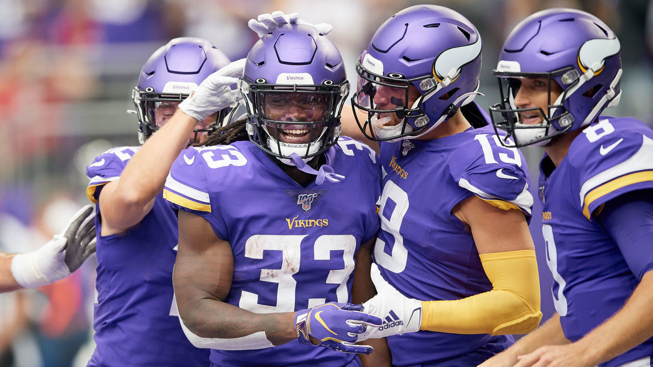 MINNEAPOLIS, MINNESOTA - SEPTEMBER 08: Dalvin Cook #33 of the Minnesota Vikings is congratulated by teammates on scoring a touchdown against the Atlanta Falcons during the game at U.S. Bank Stadium on September 8, 2019 in Minneapolis, Minnesota. The Vikings defeated the Falcons 28-12.