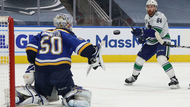 EDMONTON, ALBERTA - AUGUST 14: Goaltender Jordan Binnington #50 of the St. Louis Blues makes a save on a backhand shot by Tyler Motte #64 of the Vancouver Canucks in the third period of Game Two of the Western Conference First Round of the 2020 NHL Stanley Cup Playoff between the Vancouver Canucks and the St. Louis Blues at Rogers Place on August 14, 2020 in Edmonton, Alberta.