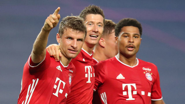 LISBON, PORTUGAL - AUGUST 19: Serge Gnabry (R) of FC Bayern Muenchen celebrates his second goal with teammates Thomas Mueller (L) and Robert Lewandowski (C) during the UEFA Champions League Semi Final match between Olympique Lyonnais and FC Bayern Muenchen at Estadio Jose Alvalade on August 19, 2020 in Lisbon, Portugal.