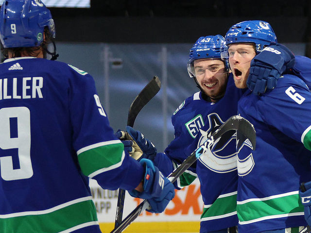 EDMONTON, ALBERTA - AUGUST 21: Brock Boeser #6 of the Vancouver Canucks celebrates with Quinn Hughes #43 and J.T. Miller #9 after Boeser scored in the second period of Game Six of the Western Conference First Round of the 2020 NHL Stanley Cup Playoff between the St. Louis Blues and the Vancouver Canucks at Rogers Place on August 21, 2020 in Edmonton, Alberta.