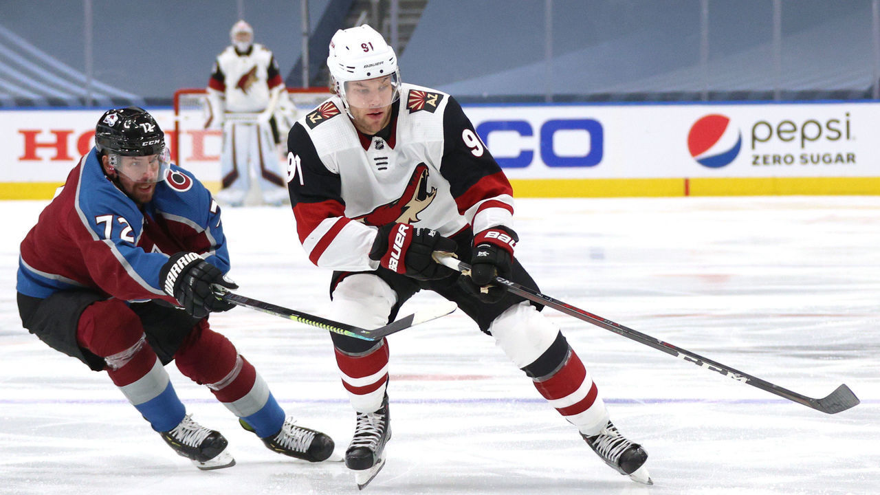 EDMONTON, ALBERTA - AUGUST 12: Joonas Donskoi #72 of the Colorado Avalanche challenges Taylor Hall #91 of the Arizona Coyotes during the third period of Game One of the Western Conference First Round of the 2020 NHL Stanley Cup Playoff at Rogers Place on August 12, 2020 in Edmonton, Alberta.