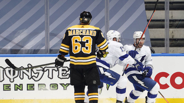 TORONTO, ONTARIO - AUGUST 05: Alex Killorn #17 and Tyler Johnson #9 of the Tampa Bay Lightning react after Johnson scored a goal as Brad Marchand #63 of the Boston Bruins looks on late in the third period of a Round Robin game during the 2020 NHL Stanley Cup Playoff at Scotiabank Arena on August 05, 2020 in Toronto, Ontario. The Lightning defeated the Bruins 3-2.