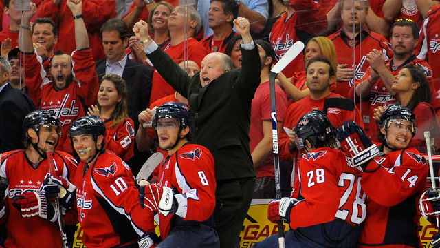 Head Coach Bruce Boudreau raises his fists in triumph as the Capitals complete a miraculous comeback from a 3-1 series deficit.