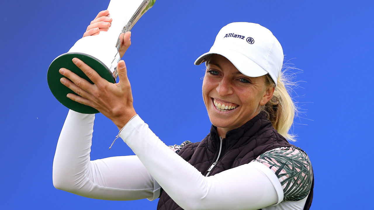TROON, SCOTLAND - AUGUST 23: Sophia Popov of Germany lifts the trophy following victory in the final round during Day Four of the 2020 AIG Women's Open at Royal Troon on August 23, 2020 in Troon, Scotland.