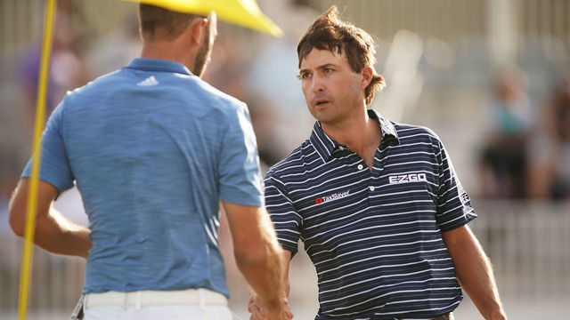 AUSTIN, TX - MARCH 23: Kevin Kisner of the United States shakes hands with Dustin Johnson of the United States after defeating him 4&3 on the 15th green during the third round of the World Golf Championships-Dell Match Play at Austin Country Club on March 23, 2018 in Austin, Texas.