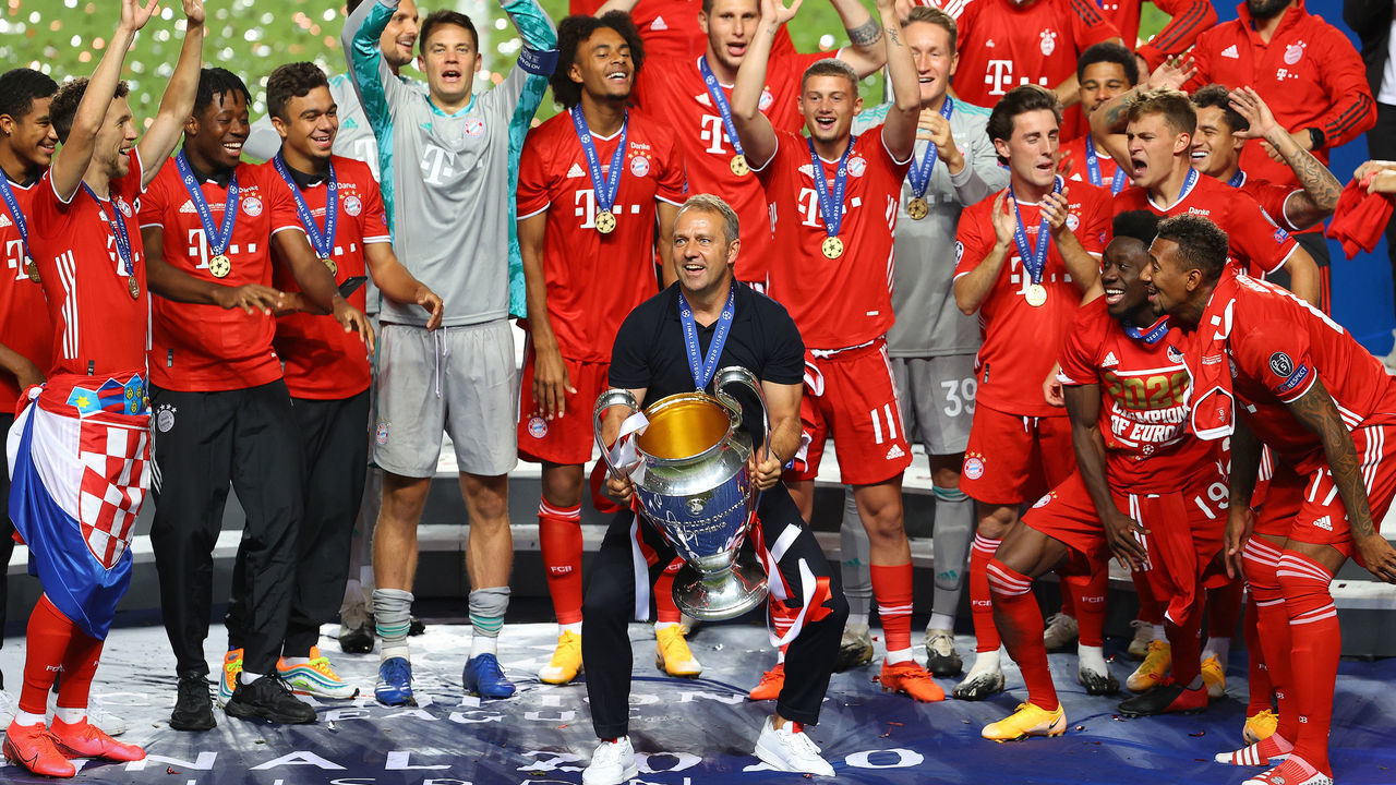 LISBON, PORTUGAL - AUGUST 23: (----EDITORIAL USE ONLY â MANDATORY CREDIT - "UEFA / JULIAN FINNEY / HANDOUT" - NO MARKETING NO ADVERTISING CAMPAIGNS - DISTRIBUTED AS A SERVICE TO CLIENTS----) Players and head coach Hans-Dieter Flick (C) of Bayern Munich celebrate at the end of the UEFA Champions League final football match between Paris Saint-Germain and Bayern Munich at the Luz stadium in Lisbon, Portugal on August 23, 2020. Bayern Munich won the match with 1-0.