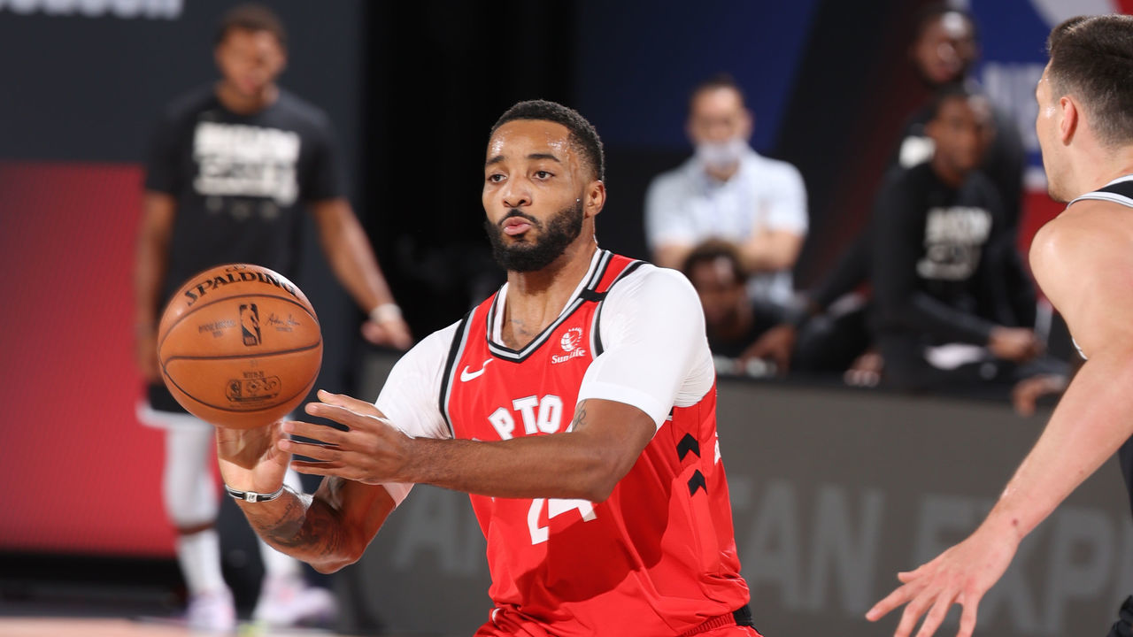 ORLANDO, FL - AUGUST 23: Norman Powell #24 of the Toronto Raptors passes the ball against the Brooklyn Nets during Round One, Game Four of the NBA Playoffs on August 23, 2020 at the The Field House at ESPN Wide World Of Sports Complex in Orlando, Florida. NOTE TO USER: User expressly acknowledges and agrees that, by downloading and/or using this Photograph, user is consenting to the terms and conditions of the Getty Images License Agreement. Mandatory Copyright Notice: Copyright 2020 NBAE