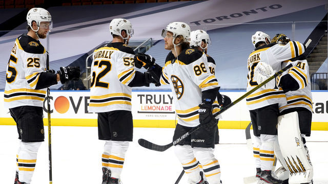TORONTO, ONTARIO - AUGUST 23: David Pastrnak #88 of the Boston Bruins celebrates defeating the Tampa Bay Lightning 3-2 with teammates after Game One of the Eastern Conference Second Round during the 2020 NHL Stanley Cup Playoffs at Scotiabank Arena on August 23, 2020 in Toronto, Ontario.
