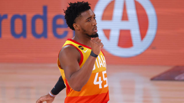 LAKE BUENA VISTA, FLORIDA - AUGUST 23: Donovan Mitchell #45 reacts after teammate Mike Conley #10 of the Utah Jazz makes a three point basket against the Denver Nuggets during the third quarter in Game Four of the Western Conference First Round during the 2020 NBA Playoffs at AdventHealth Arena at ESPN Wide World Of Sports Complex on August 23, 2020 in Lake Buena Vista, Florida.