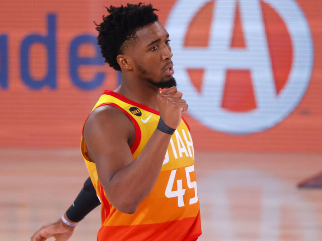 LAKE BUENA VISTA, FLORIDA - AUGUST 23: Donovan Mitchell #45 reacts after teammate Mike Conley #10 of the Utah Jazz makes a three point basket against the Denver Nuggets during the third quarter in Game Four of the Western Conference First Round during the 2020 NBA Playoffs at AdventHealth Arena at ESPN Wide World Of Sports Complex on August 23, 2020 in Lake Buena Vista, Florida.