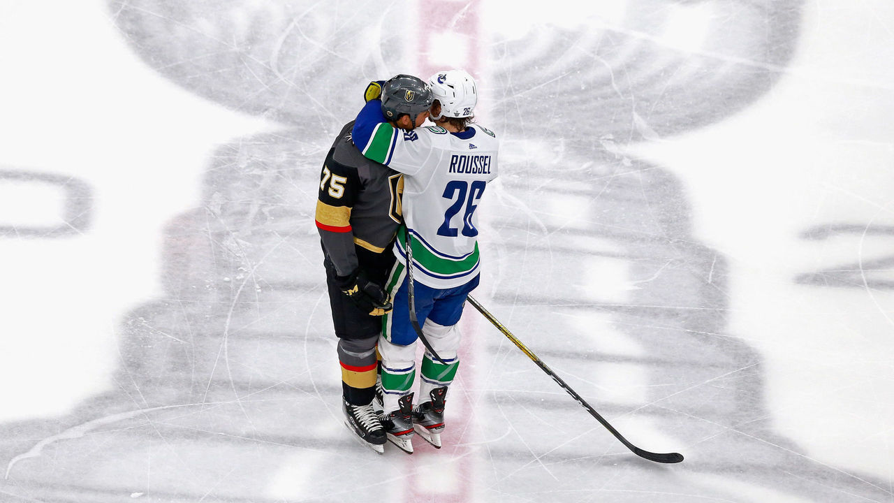 EDMONTON, ALBERTA - AUGUST 23: Antoine Roussel #26 of the Vancouver Canucks takes a third period misconduct penalty after engaging Ryan Reaves #75 of the Vegas Golden Knights in Game One of the Western Conference Second Round during the 2020 NHL Stanley Cup Playoffs at Rogers Place on August 23, 2020 in Edmonton, Alberta, Canada.