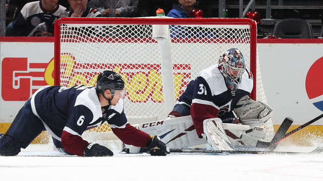 DENVER, COLORADO - OCTOBER 05: Goaltender Philipp Grubauer #31 of the Colorado Avalanche makes a save against the Minnesota Wild next to teammate Erik Johnson #6 at Pepsi Center on October 05, 2019 in Denver, Colorado.