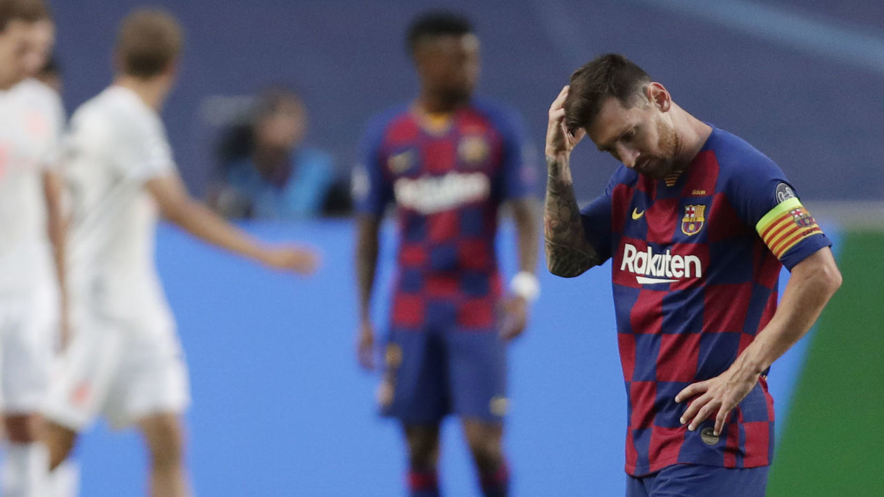 Barcelona's Argentinian forward Lionel Messi (R) reacts after Bayern Munich's second goal during the UEFA Champions League quarter-final football match between Barcelona and Bayern Munich at the Luz stadium in Lisbon on August 14, 2020.