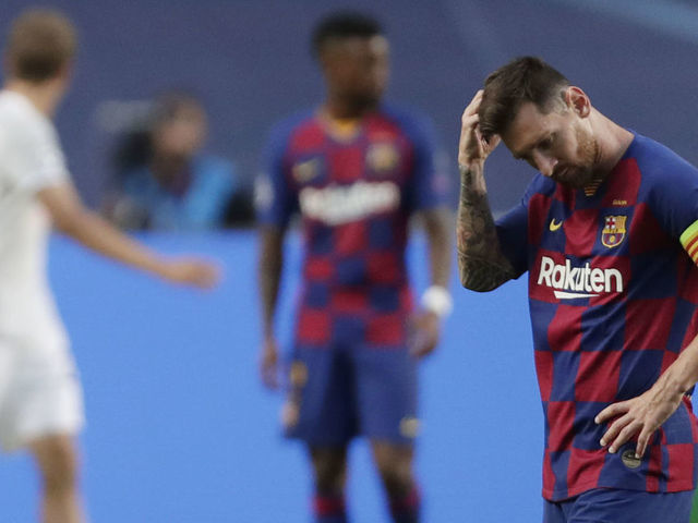 Barcelona's Argentinian forward Lionel Messi (R) reacts after Bayern Munich's second goal during the UEFA Champions League quarter-final football match between Barcelona and Bayern Munich at the Luz stadium in Lisbon on August 14, 2020.