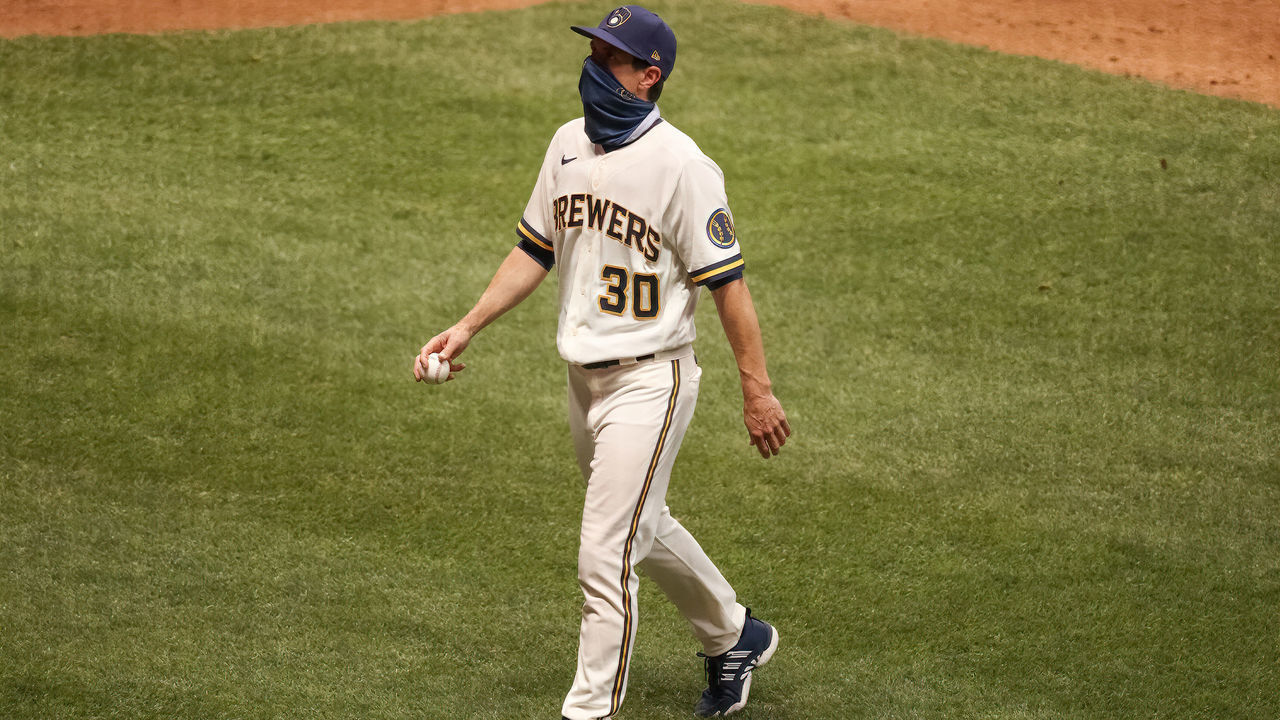 MILWAUKEE, WISCONSIN - AUGUST 03: Manager Craig Counsell of the Milwaukee Brewers walks across the field after making a pitching change in the seventh inning against the Chicago White Sox at Miller Park on August 03, 2020 in Milwaukee, Wisconsin.