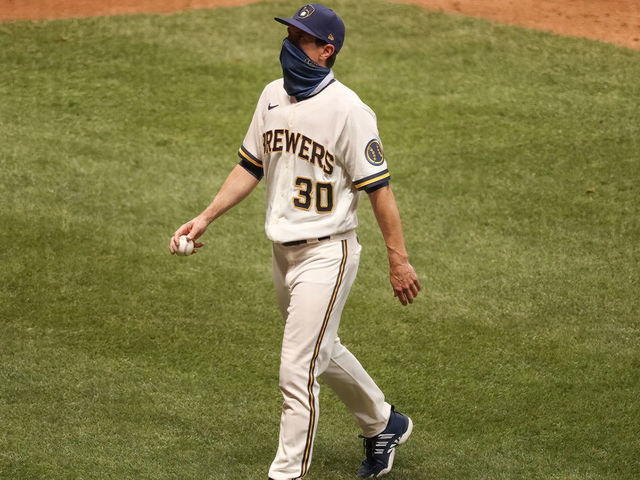 MILWAUKEE, WISCONSIN - AUGUST 03: Manager Craig Counsell of the Milwaukee Brewers walks across the field after making a pitching change in the seventh inning against the Chicago White Sox at Miller Park on August 03, 2020 in Milwaukee, Wisconsin.