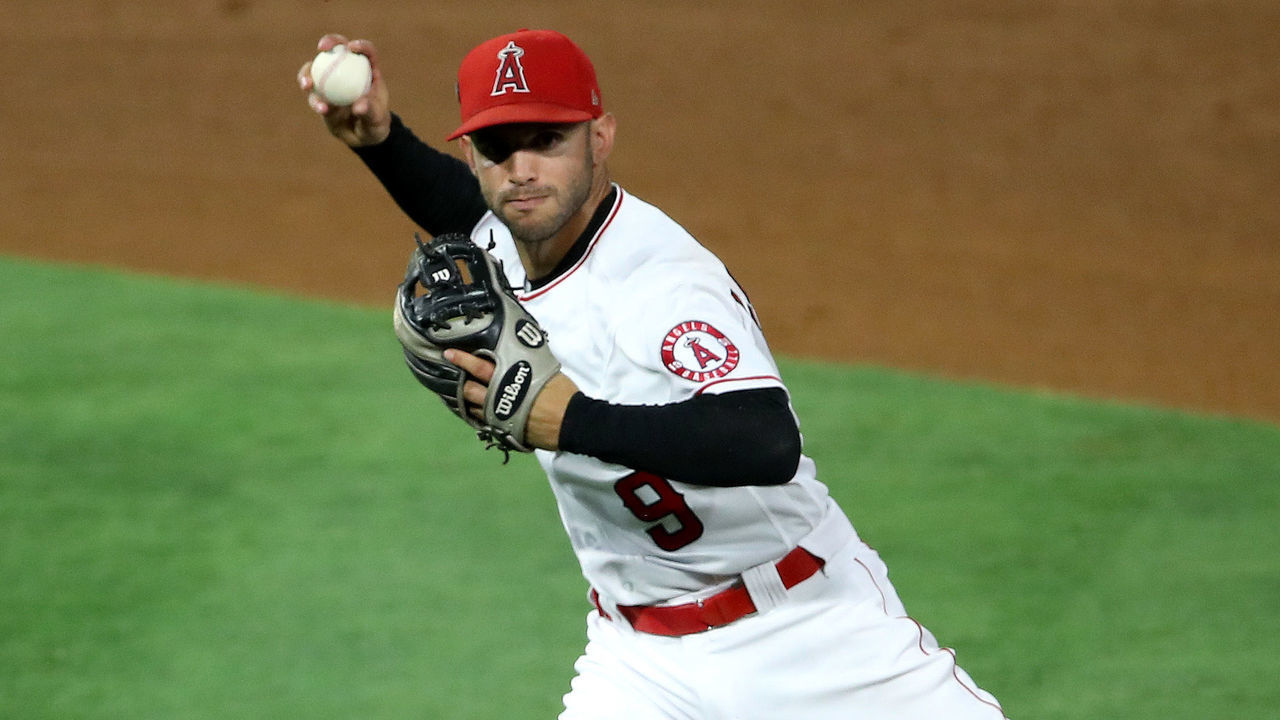 ANAHEIM, CALIFORNIA - JULY 29: Tommy La Stella #9 of the Los Angeles Angels throws out Tim Lopes #10 of the Seattle Mariners during the fourth inning of a game at Angel Stadium of Anaheim on July 29, 2020 in Anaheim, California.