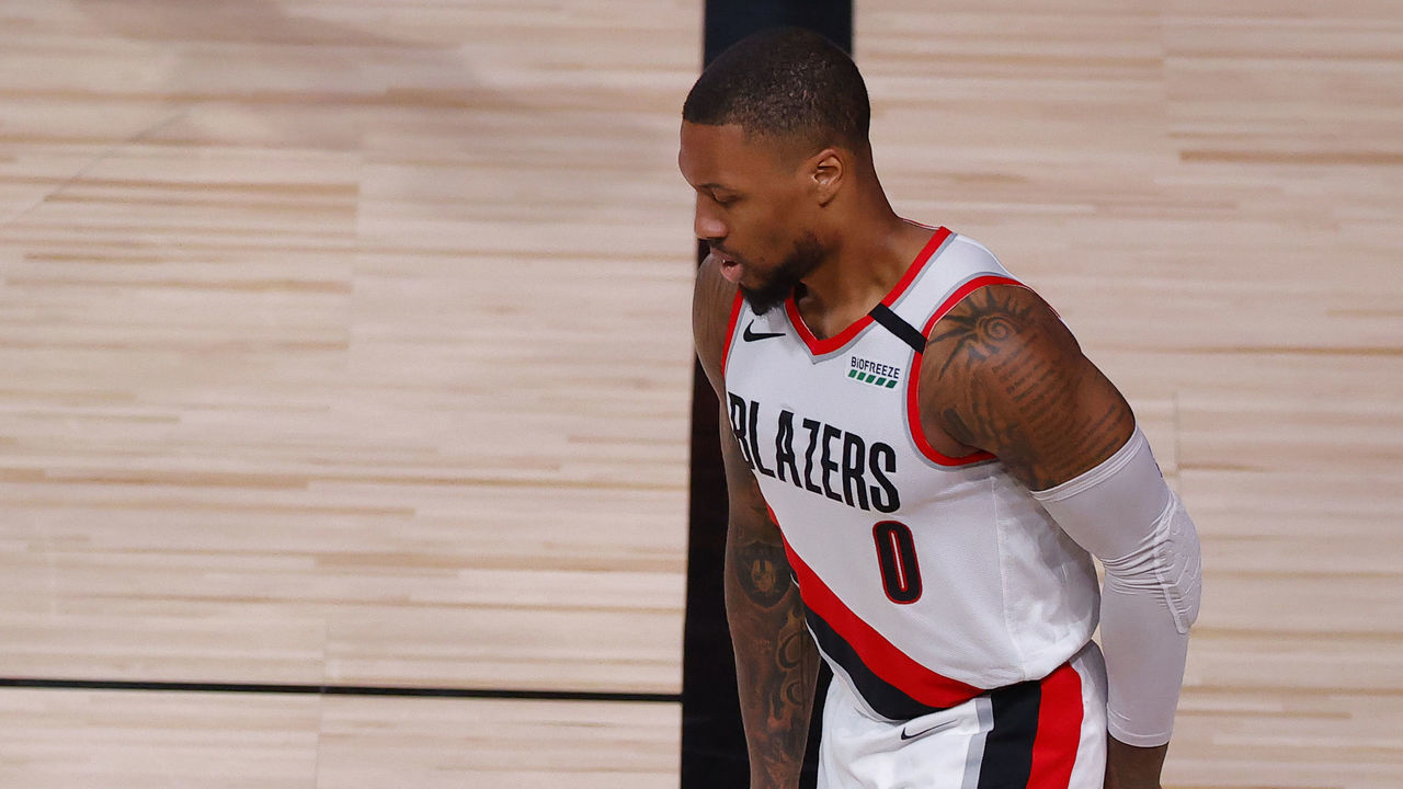 LAKE BUENA VISTA, FLORIDA - AUGUST 24: Damian Lillard #0 of the Portland Trail Blazers limps after drawing a foul against the Los Angeles Lakers during the third quarter in Game Four of the Western Conference First Round during the 2020 NBA Playoffs at AdventHealth Arena at ESPN Wide World Of Sports Complex on August 24, 2020 in Lake Buena Vista, Florida.