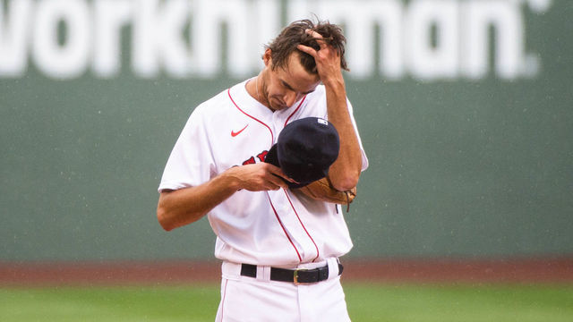 BOSTON, MA - AUGUST 19: Kyle Hart #81 of the Boston Red Sox wipes rain off of his forehead in the first inning against the Philadelphia Phillies at Fenway Park on August 19, 2020 in Boston, Massachusetts.
