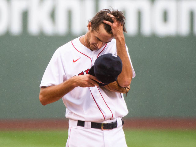 BOSTON, MA - AUGUST 19: Kyle Hart #81 of the Boston Red Sox wipes rain off of his forehead in the first inning against the Philadelphia Phillies at Fenway Park on August 19, 2020 in Boston, Massachusetts.
