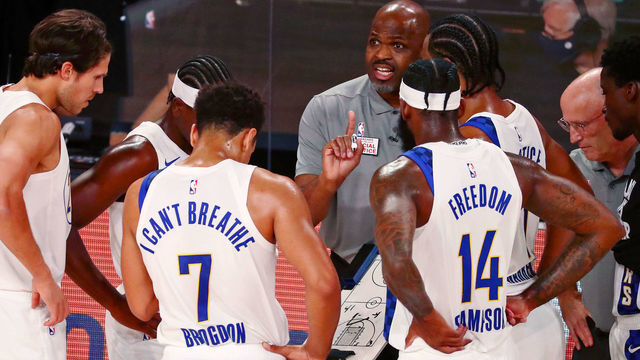 LAKE BUENA VISTA, FLORIDA - AUGUST 22: Head coach Nate McMillan of the Indiana Pacers talks with his team during a time out during the first half of Game 3 of an NBA basketball first-round playoff series against the Miami Heat at AdventHealth Arena on August 22, 2020 in Lake Buena Vista, Florida.