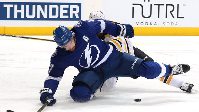 TORONTO, ONTARIO - AUGUST 23: Ryan McDonagh #27 of the Tampa Bay Lightning falls to the ice in front of Connor Clifton #75 of the Boston Bruins during the third period of Game One of the Eastern Conference Second Round during the 2020 NHL Stanley Cup Playoffs at Scotiabank Arena on August 23, 2020 in Toronto, Ontario.