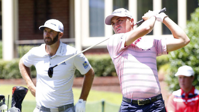 MEMPHIS, TN - JULY 25: Justin Thomas hits a tee shot as Dustin Johnson looks on during the opening round of the World Golf Championships - FedEx St. Jude Invitational, July 25, 2019 at TPC Southwind in Memphis, Tennessee.