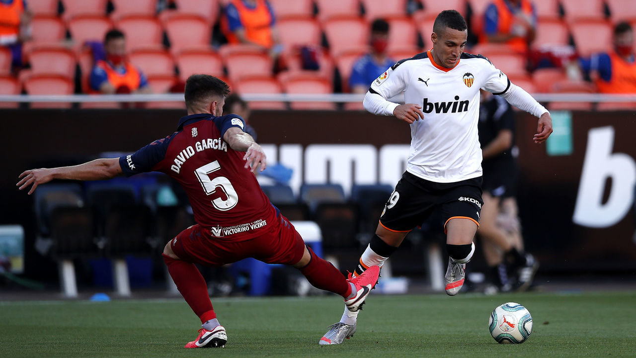 VALENCIA, SPAIN - JUNE 21: Rodrigo Moreno of Valencia CF battles for possession with Raul Navas of CA Osasuna during the La Liga match between Valencia CF and CA Osasuna at Estadio Mestalla on June 21, 2020 in Valencia, Spain.