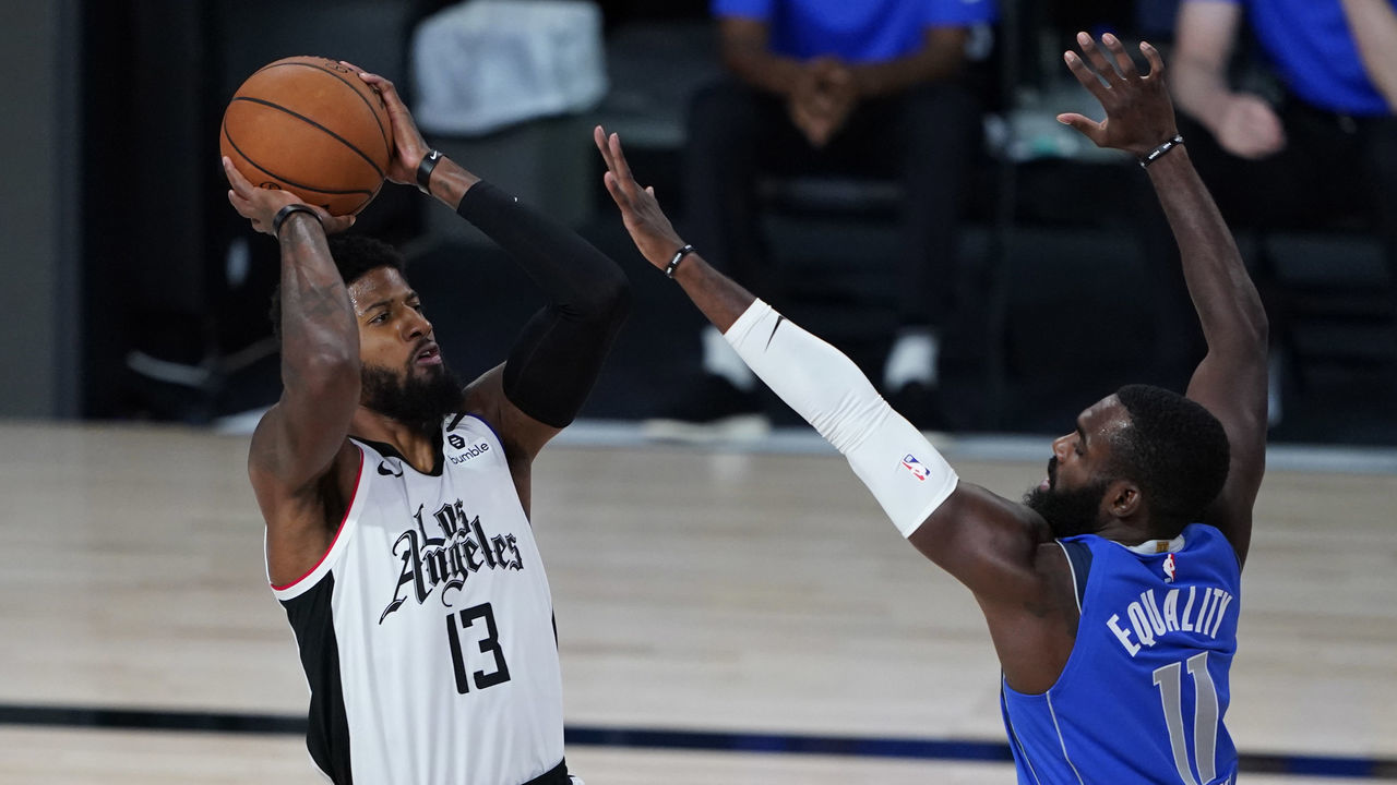 LAKE BUENA VISTA, FLORIDA - AUGUST 25: Tim Hardaway Jr. #11 of the Dallas Mavericks covers Paul George #13 of the LA Clippers in the first half in game five of the first round of the 2020 NBA Playoffs at ESPN Wide World Of Sports Complex on August 25, 2020 in Lake Buena Vista, Florida.