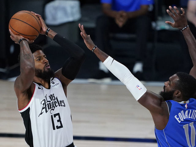 LAKE BUENA VISTA, FLORIDA - AUGUST 25: Tim Hardaway Jr. #11 of the Dallas Mavericks covers Paul George #13 of the LA Clippers in the first half in game five of the first round of the 2020 NBA Playoffs at ESPN Wide World Of Sports Complex on August 25, 2020 in Lake Buena Vista, Florida.