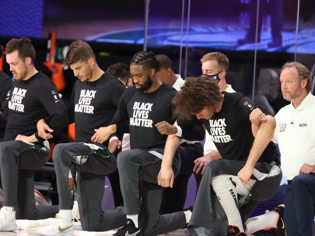 ORLANDO FL - AUGUST 20 The Milwaukee Bucks kneel during the National Anthem before the game against the Orlando Magic during Round One Game Two of the NBA Playoffs on August 20 2020 at the The Field House at ESPN Wide World Of Sports Complex in Orlando Florida NOTE TO USER User expressly acknowledges and agrees that by downloading andor using this Photograph user is consenting to the terms and conditions of the Getty Images License Agreement Mandatory Copyright Notice Copyright 2020 NBAE