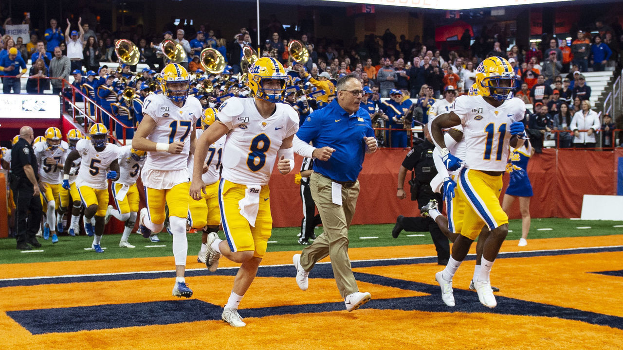 SYRACUSE, NY - OCTOBER 18: Pittsburgh Panthers Quarterback Kenny Pickett (8) and Pittsburgh Panthers Head Coach Pat Narduzzi and Pittsburgh Panthers Wide Receiver Taysir Mack (11) lead the team onto the field prior to the game between the Pittsburgh Panthers and the Syracuse Orange on October 18, 2019, at the Carrier Dome in Syracuse, NY.