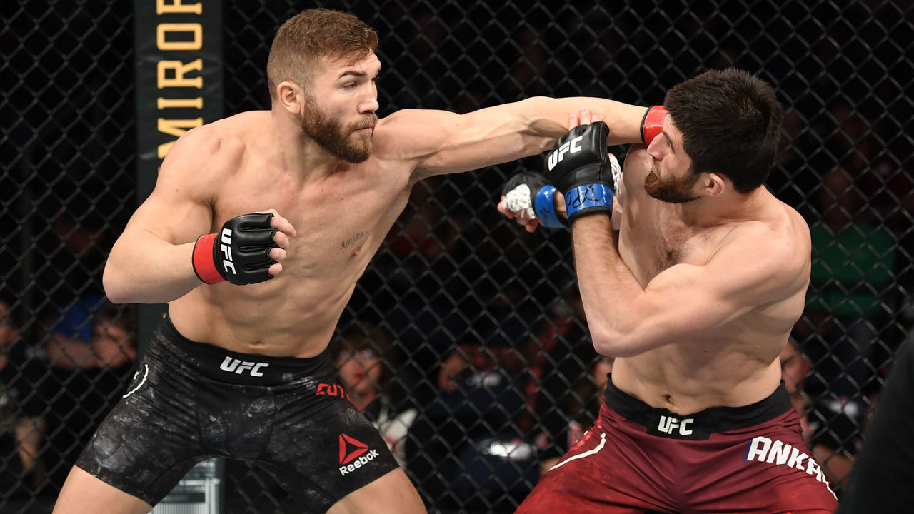 NORFOLK, VA - FEBRUARY 29: (L-R) Ion Cutelaba punches Magomed Ankalaev in their light heavyweight bout during the UFC Fight Night event at Chartway Arena on February 29, 2020 in Norfolk, Virginia.