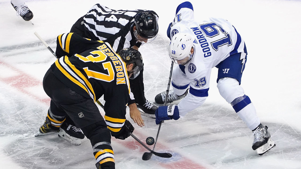 TORONTO, ONTARIO - AUGUST 05: Patrice Bergeron #37 of the Boston Bruins takes the second period face-off against Barclay Goodrow #19 of the Tampa Bay Lightning in an Eastern Conference Round Robin game during the 2020 NHL Stanley Cup Playoff at Scotiabank Arena on August 5, 2020 in Toronto, Ontario, Canada.