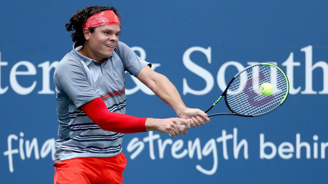 NEW YORK, NEW YORK - AUGUST 28: Milos Raonic of Canada returns a shot to Stefanos Tsitsipas of Greece in their semifinal match during the Western & Southern Open at the USTA Billie Jean King National Tennis Center on August 28, 2020 in the Queens borough of New York City.