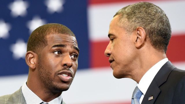 NBA players association president Chris Paul (L) introduces US President Barack Obama during a town hall meeting focusing on the importance of the My Brothers Keeper Initiative at the Walker Jones Education Campus in Washington, DC, on July 21, 2014. AFP PHOTO/Jewel Samad