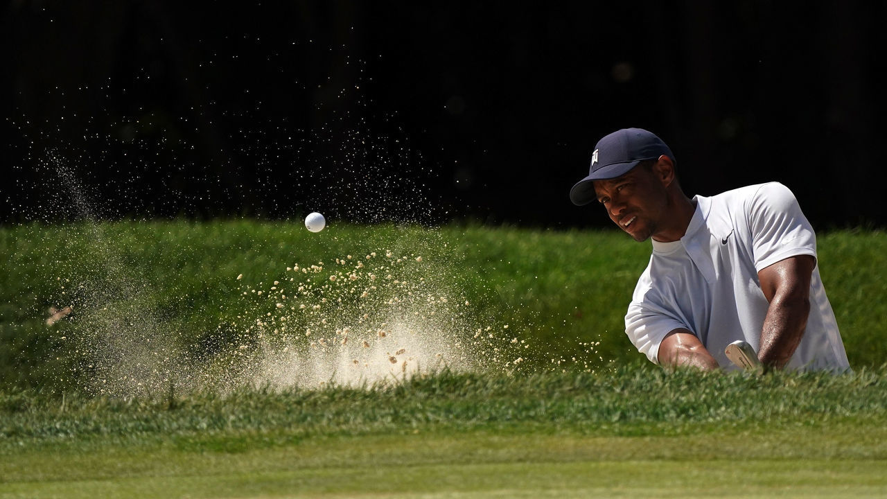 OLYMPIA FIELDS, ILLINOIS - AUGUST 28: Tiger Woods of the United States plays a shot from a bunker on the first hole during the second round of the BMW Championship on the North Course at Olympia Fields Country Club on August 28, 2020 in Olympia Fields, Illinois.