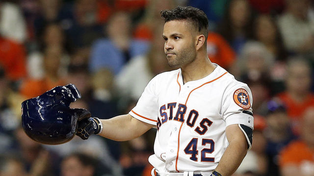 HOUSTON, TX - APRIL 15: Jose Altuve #27 of the Houston Astros reacts after a strike out against the Texas Rangers at Minute Maid Park on April 15, 2018 in Houston, Texas. All players are wearing #42 in honor of Jackie Robinson Day.