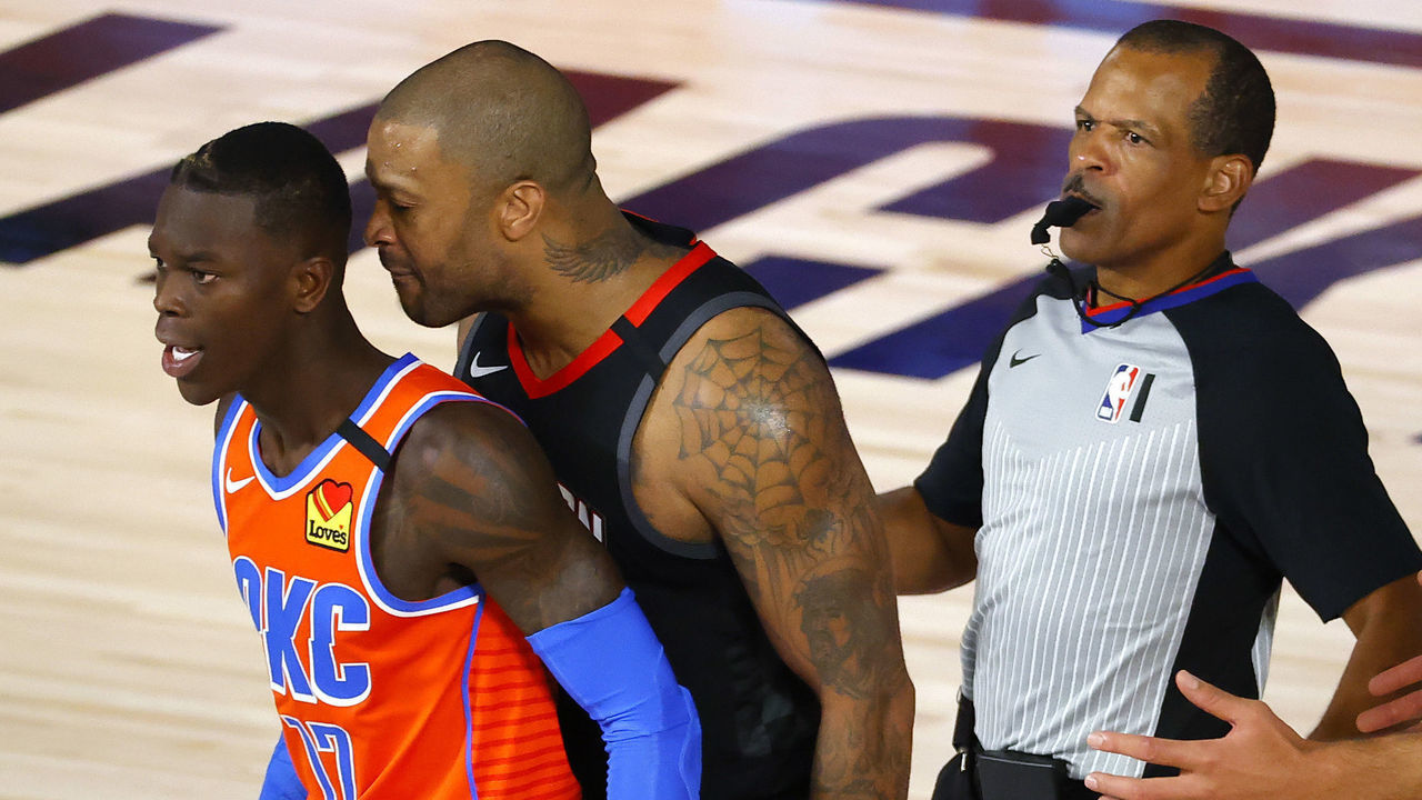 LAKE BUENA VISTA, FLORIDA - AUGUST 29: P.J. Tucker #17 of the Houston Rockets head butts Dennis Schroder #17 of the Oklahoma City Thunder as referee Eric Lewis #42 runs in during the third quarter in Game Five of the Western Conference First Round during the 2020 NBA Playoffs at the Field House at ESPN Wide World Of Sports Complex on August 29, 2020 in Lake Buena Vista, Florida. Both players were ejected after the altercation.