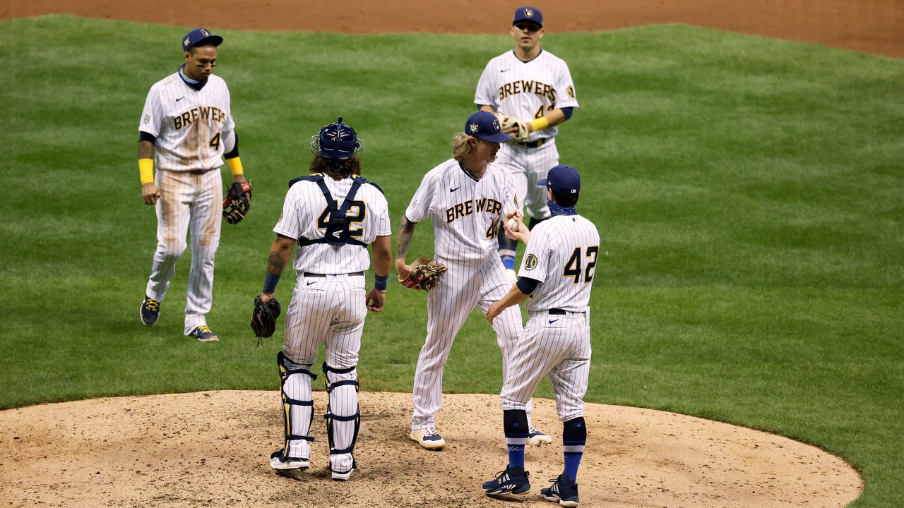 MILWAUKEE, WISCONSIN - AUGUST 29: Manager Craig Counsell #42 of the Milwaukee Brewers relieves Josh Hader #42 in the ninth inning against the Pittsburgh Pirates at Miller Park on August 29, 2020 in Milwaukee, Wisconsin. All players are wearing #42 in honor of Jackie Robinson Day. The day honoring Jackie Robinson, traditionally held on April 15, was rescheduled due to the COVID-19 pandemic.