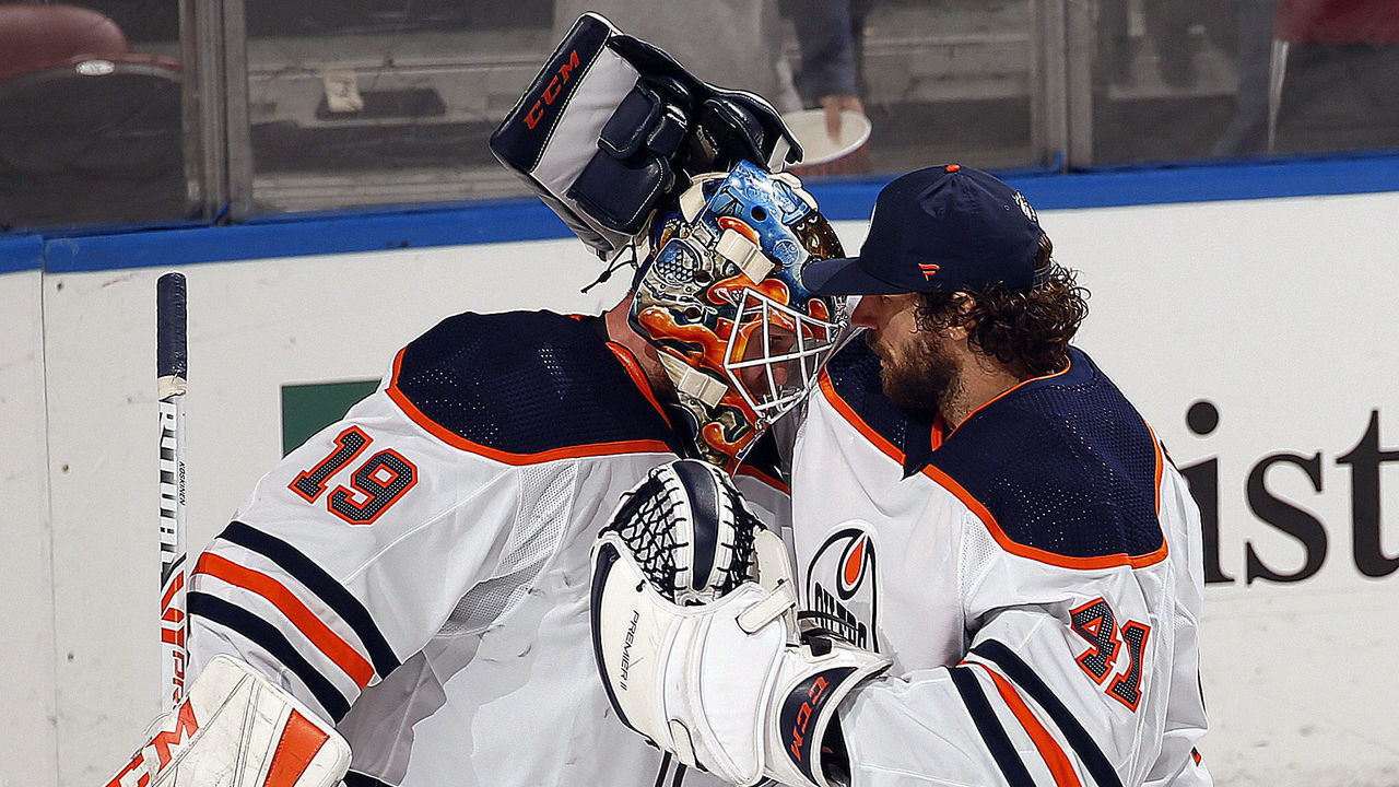 SUNRISE, FL - FEBRUARY 15: Fellow Goaltenders Mikko Koskinen #19 and Mike Smith #41 of the Edmonton Oilers celebrate 4-1 win over the Florida Panthers at the BB&T Center on February 15, 2020 in Sunrise, Florida.