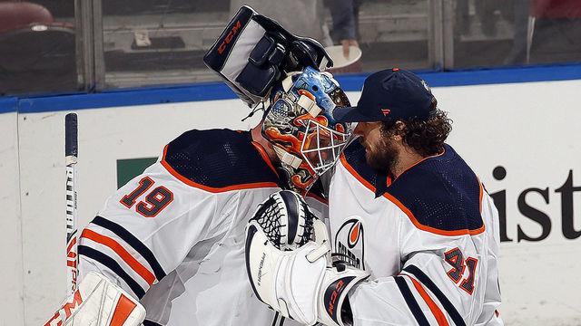 SUNRISE, FL - FEBRUARY 15: Fellow Goaltenders Mikko Koskinen #19 and Mike Smith #41 of the Edmonton Oilers celebrate 4-1 win over the Florida Panthers at the BB&T Center on February 15, 2020 in Sunrise, Florida.