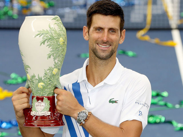 NEW YORK, NEW YORK - AUGUST 29: Novak Djokovic of Serbia poses with the winner's trophy after defeating Milos Raonic of Canada in the men's singles final of the Western & Southern Open at the USTA Billie Jean King National Tennis Center on August 29, 2020 in the Queens borough of New York City.