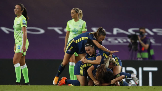 Lyon's players celebrate after Lyon's Japanese midfielder Saki Kumagai (hidden at bottom C) scored the 2-0 goal during the UEFA Women's Champions League final football match between VfL Wolfsburg and Lyon at the Anoeta stadium in San Sebastian on August 30, 2020.