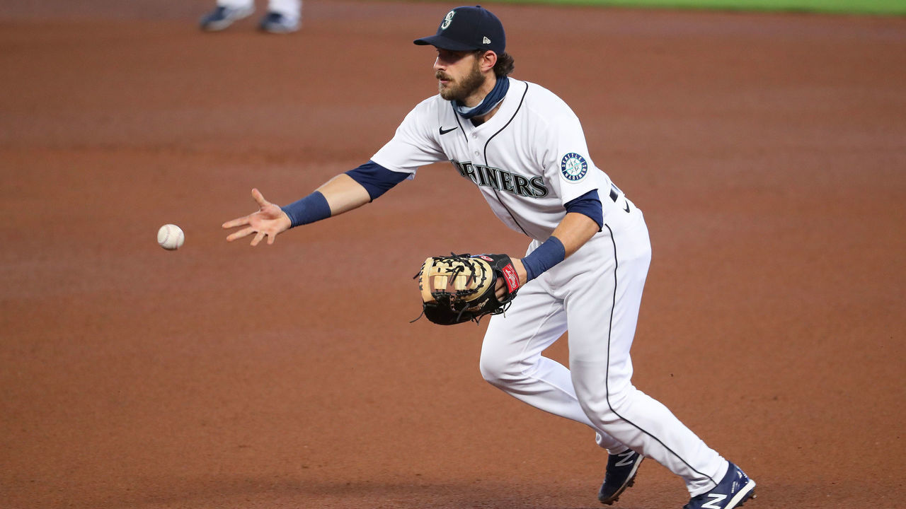 SEATTLE, WASHINGTON - AUGUST 20: Austin Nola #23 of the Seattle Mariners makes a play at first to record an out in the fourth inning against the Los Angeles Dodgers at T-Mobile Park on August 20, 2020 in Seattle, Washington.