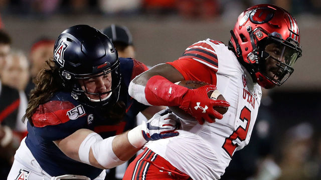TUCSON, AZ - NOVEMBER 23: Arizona Wildcats linebacker Colin Schooler (7) tackles Utah Utes running back Zack Moss (2) during the first half of the college football game at Arizona Stadium on November 23, 2019 in Tucson, Arizona.